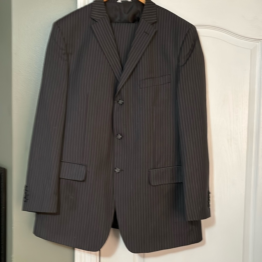 Lovely 46 Long striped suit by LINEA UOMO is beautiful. It is a grayish brown.